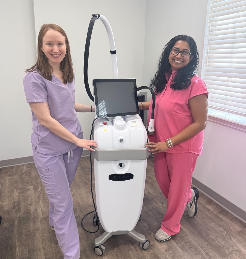 two dermatologists standing next to the UltraClear Laser Skin rejuvenation machine